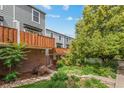 Exterior of home with manicured landscaping, private patios, and mature trees offering shade at 1111 Maxwell Ave # 228, Boulder, CO 80304