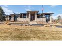 Beautiful home exterior with stone facade, modern design, and spacious yard at 5429 S Kearney St, Greenwood Village, CO 80111