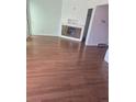 Bright living room featuring hardwood floors and fireplace at 11761 E Canal Dr, Aurora, CO 80011