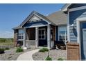 Charming brick and siding home, detailed with a cozy covered front porch at 31353 E 163Rd Ave, Hudson, CO 80642