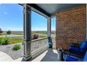 Relaxing porch view featuring blue seating and a view of the open landscape at 31353 E 163Rd Ave, Hudson, CO 80642
