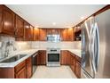 Updated kitchen featuring stainless steel appliances, granite countertops and ample cabinet space at 1029 E 8Th Ave # 1302, Denver, CO 80218
