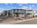 Contemporary two-story home with a stone-accented facade and well-maintained landscaping at 8403 Rush Creek Ave, Littleton, CO 80125
