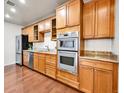 Well-equipped kitchen with stainless steel appliances, ample cabinet space, and granite countertops at 2200 S University Blvd # 105, Denver, CO 80210