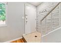 Inviting entryway features tile flooring and a staircase leading to the next level at 1060 S Parker Rd # 25, Denver, CO 80231