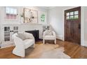 Bright living room with hardwood floors, fireplace, modern decor, and natural light at 660 S Clarkson St, Denver, CO 80209