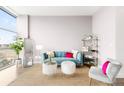 Bright living room featuring stylish furniture, large window, and minimalist decor at 2958 Syracuse St # 412, Denver, CO 80238