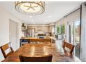 Bright kitchen with stainless steel appliances, spacious countertops, and a dining area at 7925 W Layton Ave # 500, Littleton, CO 80123