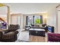 Inviting living room features large windows, comfortable seating and hardwood flooring at 7925 W Layton Ave # 500, Littleton, CO 80123