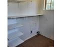 White room with floating shelves that offers ample storage space at 256 S 2Nd Ave, Brighton, CO 80601