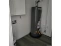 Room with a new hot water heater and cabinets, ready for modern living at 256 S 2Nd Ave, Brighton, CO 80601