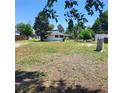 This property offers a large yard with scattered trees providing natural shade at 256 S 2Nd Ave, Brighton, CO 80601