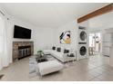 Living room features a fireplace and open concept to kitchen at 17286 E Ford Dr, Aurora, CO 80017