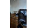 Cozy living area with hardwood floors and a plush leather sofa at 1900 Quebec St, Denver, CO 80220