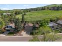 Spacious home with a large yard, nestled in a serene neighborhood with lush green surroundings at 14418 W Bayaud Ave, Golden, CO 80401