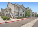 Attractive apartment complex featuring a blend of siding and stone accents and staircase entry at 1831 S Dunkirk St # 103, Aurora, CO 80017