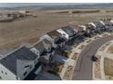 A wide view of a residential street with well-maintained homes and landscaping at 15076 W 93Rd Ave, Arvada, CO 80007