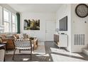 Comfortable living room with a modern design, bright light, and elegant decor at 1356 S Boston Ct # B, Denver, CO 80247