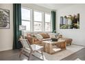 Cozy living room filled with natural light, modern furniture, and stylish decor at 1356 S Boston Ct # B, Denver, CO 80247