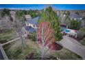 Aerial view of the home featuring a private backyard oasis and a sparkling pool at 6724 S Yates Ct, Littleton, CO 80128