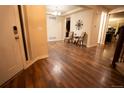 Inviting entryway featuring hardwood floors and a view into the living space at 25669 E Fair Dr, Aurora, CO 80016