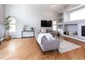 Bright living room featuring hardwood floors, high ceilings, and a cozy sitting area at 257 Cherry St, Castle Rock, CO 80104