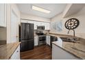 Modern kitchen with stainless steel appliances and granite countertops at 750 Copper Ln # 102, Louisville, CO 80027