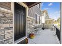 Welcoming front porch with a cozy seating area, perfect for relaxing and enjoying the neighborhood at 8863 Osceola St, Westminster, CO 80031