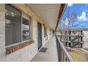 Exterior hallway featuring secured entry, modern design, and a well-lit pathway to each unit at 5995 E Iliff Ave # 308, Denver, CO 80222