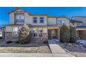 Tan two-story townhome with stone accents and landscaping at 750 Vista Verde Hts, Monument, CO 80132