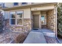 Townhome entrance with stone and landscaping at 750 Vista Verde Hts, Monument, CO 80132