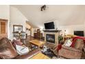 Inviting living room with fireplace, TV, and wood floors at 505 S Main St # 2207, Breckenridge, CO 80424