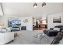 Bright living room open to kitchen features modern furnishings and lots of space at 6240 Everett Ct # F, Arvada, CO 80004