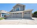 Charming two-story home featuring a two-car garage and covered porch entrance at 6833 E 115Th Ave, Thornton, CO 80233