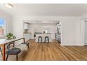 Open floorplan with bright living space features seamlessly connected kitchen and dining areas at 2965 Ivy St, Denver, CO 80207