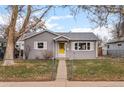 Charming single-story home featuring a well-maintained lawn and a welcoming entrance at 2248 Lima St, Aurora, CO 80010