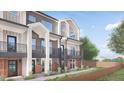 Two-story townhouses featuring balconies and a shared walkway at 4537 Tabor St, Wheat Ridge, CO 80033
