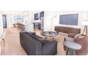 Open concept living space with modern kitchen and hardwood floors at 4537 Tabor St, Wheat Ridge, CO 80033