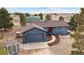 Charming single-Gathering home with detached garage, well-maintained landscape, and mature trees at 6200 Bow Meadows Dr, Elizabeth, CO 80107
