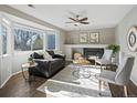 Inviting living room with a fireplace, large windows, and comfortable seating at 5115 S Valdai St, Aurora, CO 80015