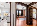 Bright living room featuring beautiful hardwood floors, exposed brick wall, and large windows overlooking the city at 1475 N Humboldt St # 20, Denver, CO 80218