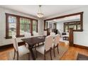 Elegant dining room featuring hardwood floors, natural light, and space for entertaining at 4010 Grove St, Denver, CO 80211