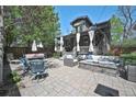 Cozy backyard with a paved patio, comfortable seating, and a serene atmosphere at 1027 S University Blvd, Denver, CO 80209
