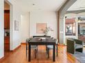 Elegant dining room featuring a stylish table, chairs, and hardwood floors at 3249 W Fairview Pl # 106, Denver, CO 80211