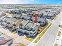 Stunning aerial view of a residential neighborhood with well-maintained homes and tree-lined streets at 700 Lillibrook Pl, Erie, CO 80026