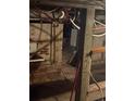 Basement with exposed brick walls, visible pipes, and a utility sink at 1901 N Emerson St, Denver, CO 80218