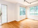 Bright living room with sliding door access and views from the room's multiple windows at 13894 E Lehigh Ave # G, Aurora, CO 80014