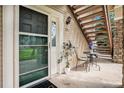 Charming entrance with seating area and unit number visible, showcasing a welcoming atmosphere at 4085 S Crystal Cir # 104, Aurora, CO 80014