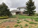 Two-story home with brick and siding featuring mature trees in an establishing neighborhood at 12904 N 3Rd St, Parker, CO 80134