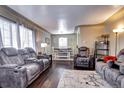 Open living and dining area with hardwood floors and lots of light at 2391 Lansing St, Aurora, CO 80010